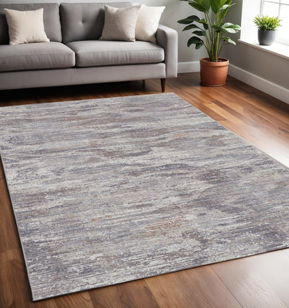5' X 8' Tan And Gray Abstract Distressed Area Rug