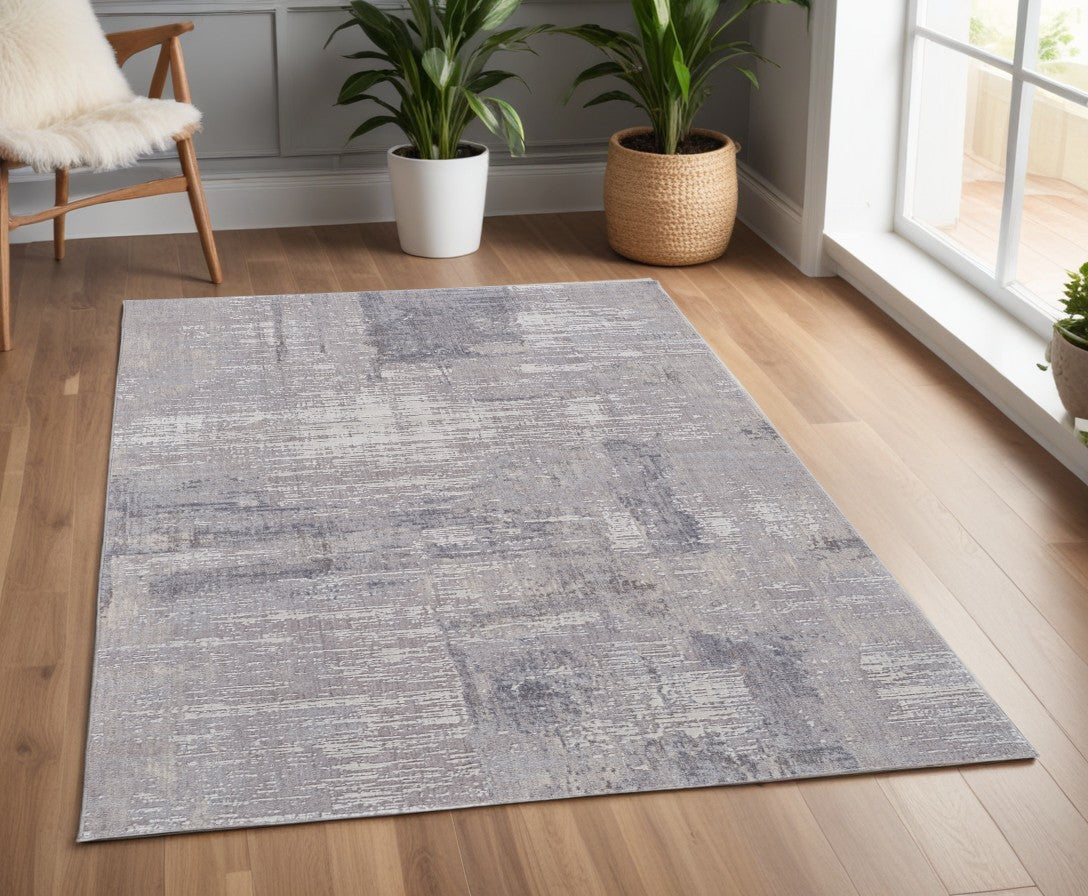 4' X 6' Tan and Blue Abstract Power Loom Distressed Area Rug