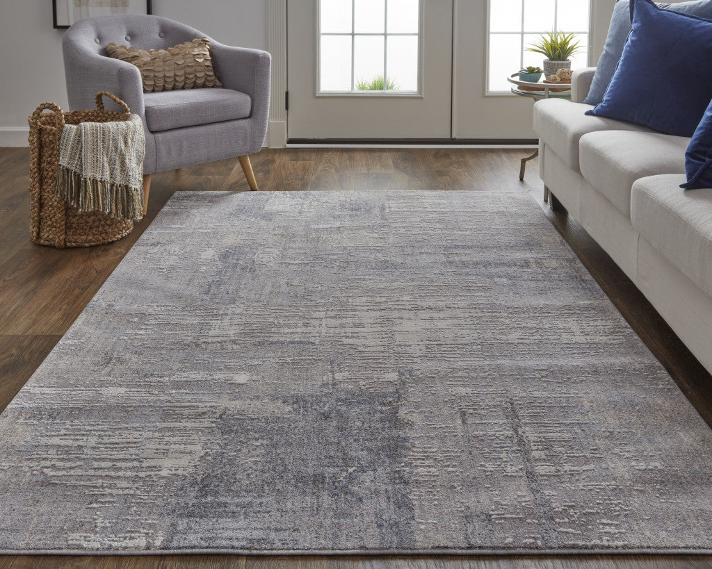 7' X 9' Taupe Tan And Blue Abstract Power Loom Distressed Stain Resistant Area Rug