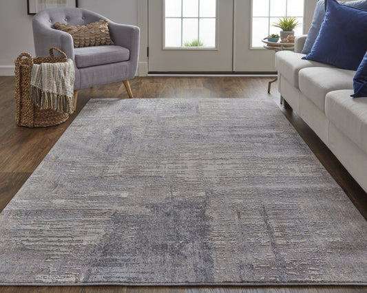 7' X 9' Tan and Blue Abstract Power Loom Distressed Area Rug