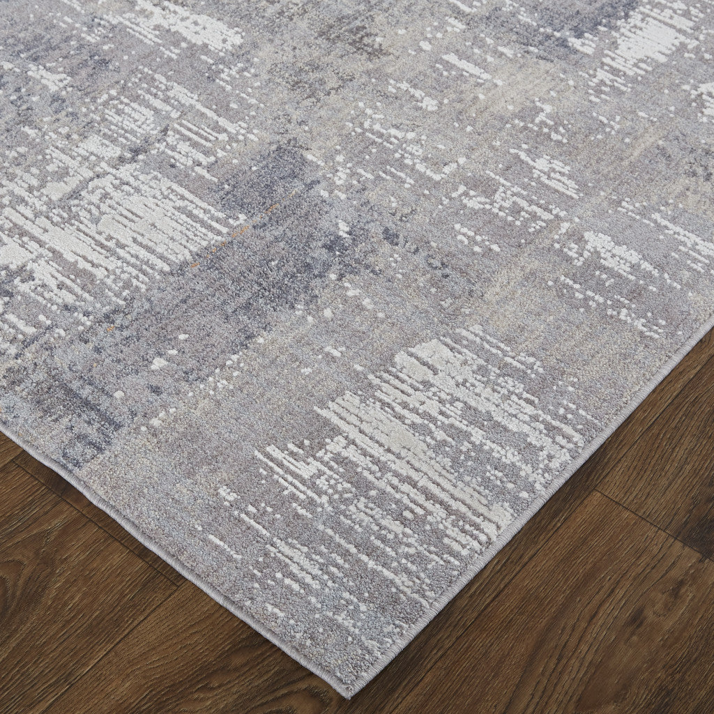 7' X 9' Taupe Tan And Blue Abstract Power Loom Distressed Stain Resistant Area Rug