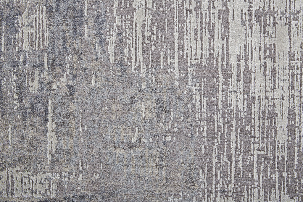 7' X 9' Taupe Tan And Blue Abstract Power Loom Distressed Stain Resistant Area Rug