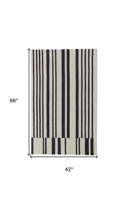 5' X 8' Ivory and Black Wool Abstract Hand Tufted Area Rug