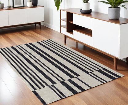 5' X 8' Ivory and Black Wool Abstract Hand Tufted Area Rug