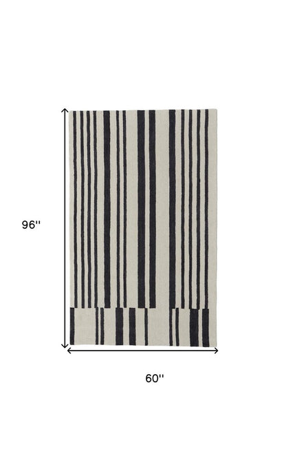 5' X 8' Ivory and Black Wool Abstract Hand Tufted Area Rug