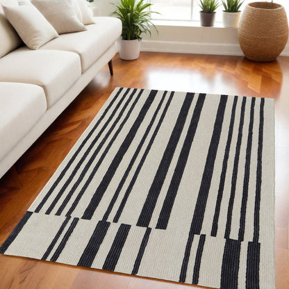 5' X 8' Ivory and Black Wool Abstract Hand Tufted Area Rug