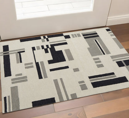 4' X 6' Ivory Black And Gray Wool Abstract Hand Tufted Area Rug