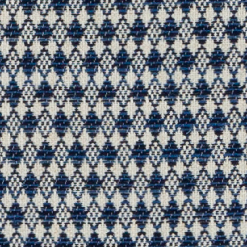 Blue and navy geometric woven fabric with small diamond/star motifs on white background.