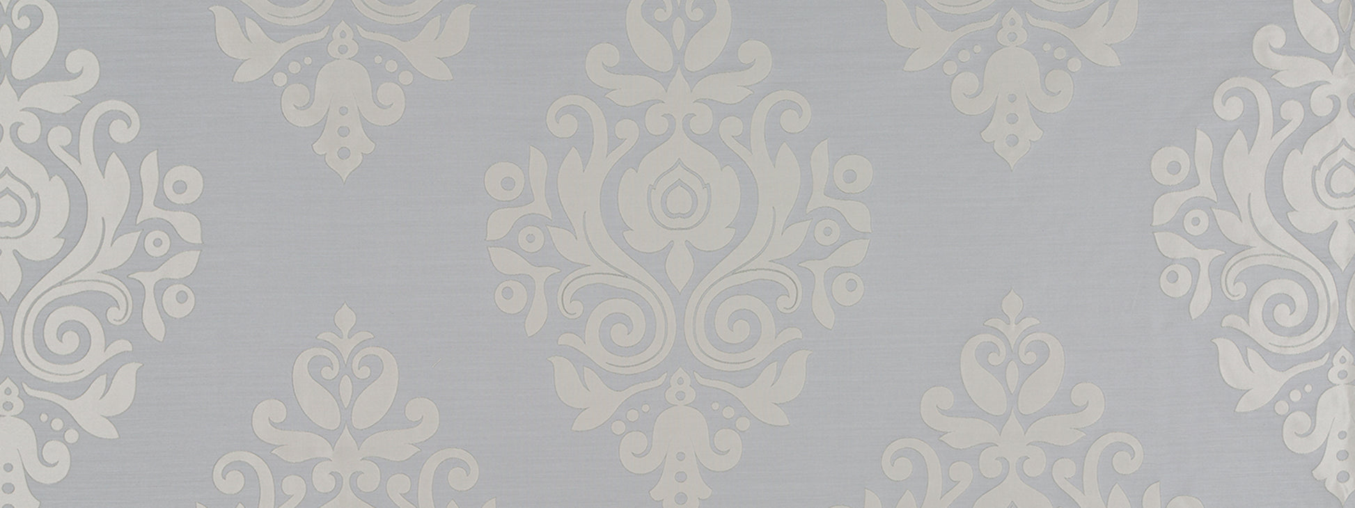 Blue-gray damask motif in a silver frame; vintage, elegant wall decor.