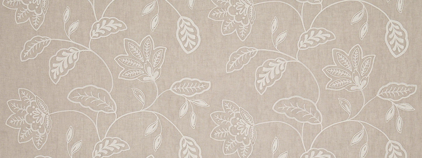 Beige linen-look drapery fabric featuring a white botanical floral vine pattern.