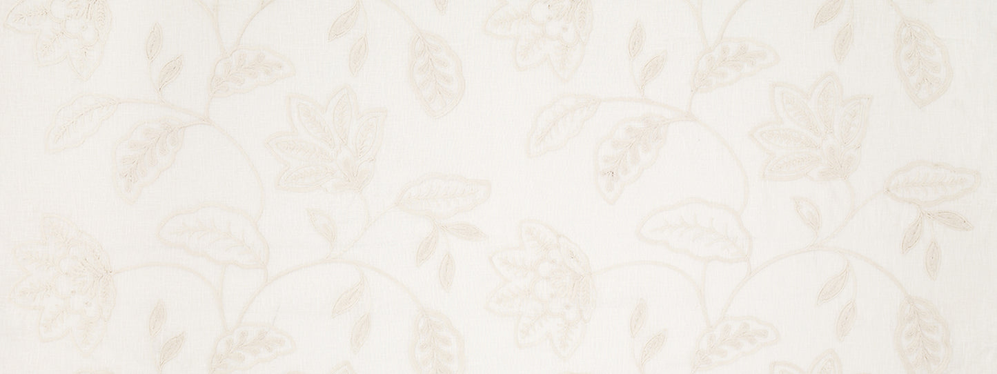 Ivory drapery with a subtle beige floral vine pattern of leaves and intertwining stems.