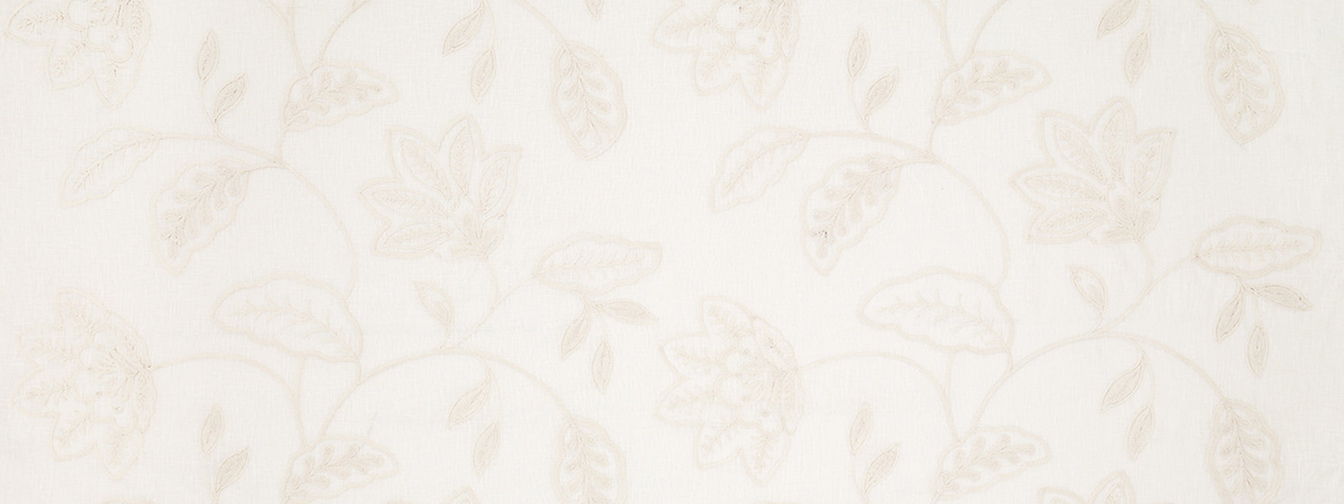 Ivory drapery with a subtle beige floral vine pattern of leaves and intertwining stems.