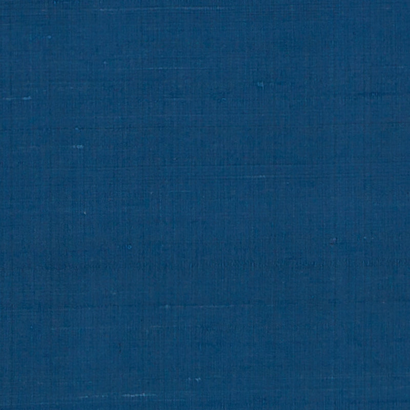 Solid deep blue linen-like drapery fabric swatch with visible weave texture