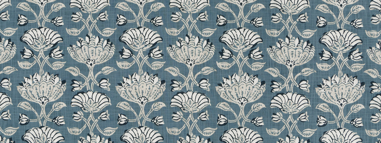 Blue wallpaper featuring a white ornate damask floral pattern.
