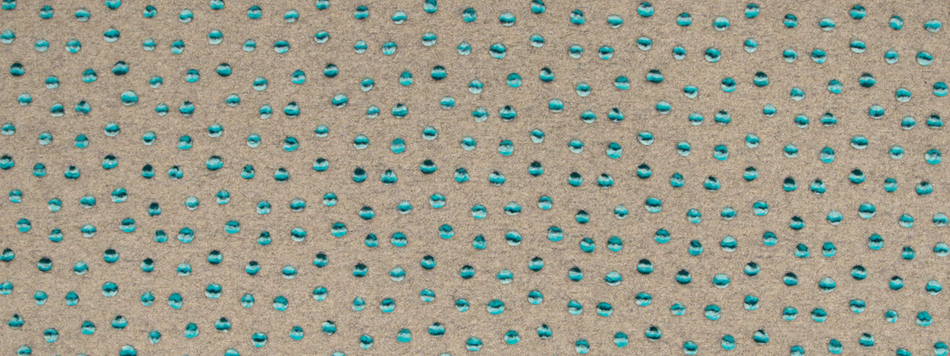 Beige textured fabric with small teal teardrop dots in a regular grid.