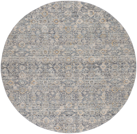 Round blue-gray rug with distressed vintage pattern of ivory floral medallions, soft and ornate.