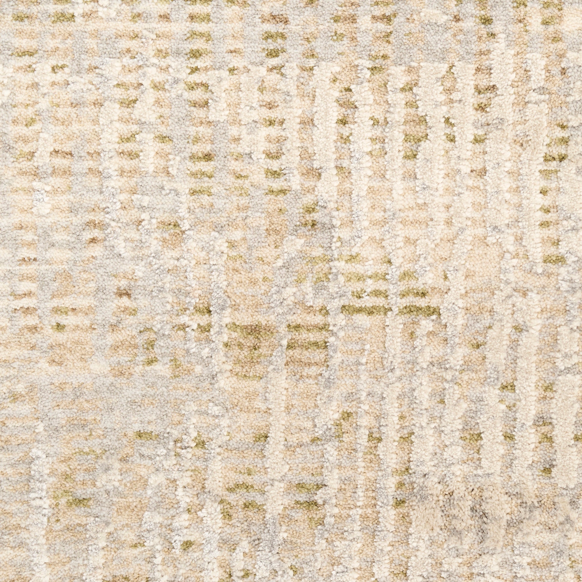 Neutral beige textured rug with subtle cream and sage accents in a soft abstract pattern.