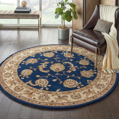 Round navy blue & beige oriental rug with floral border, plush woven pile for living room seating.