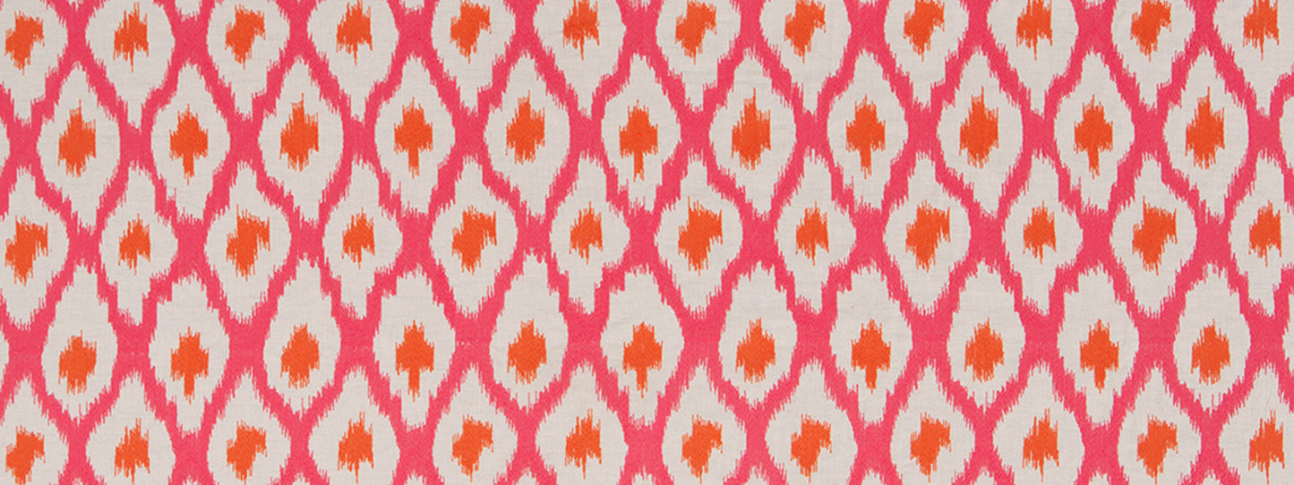 Close-up fabric pattern: pink diamond lattice with orange centers on a light background.