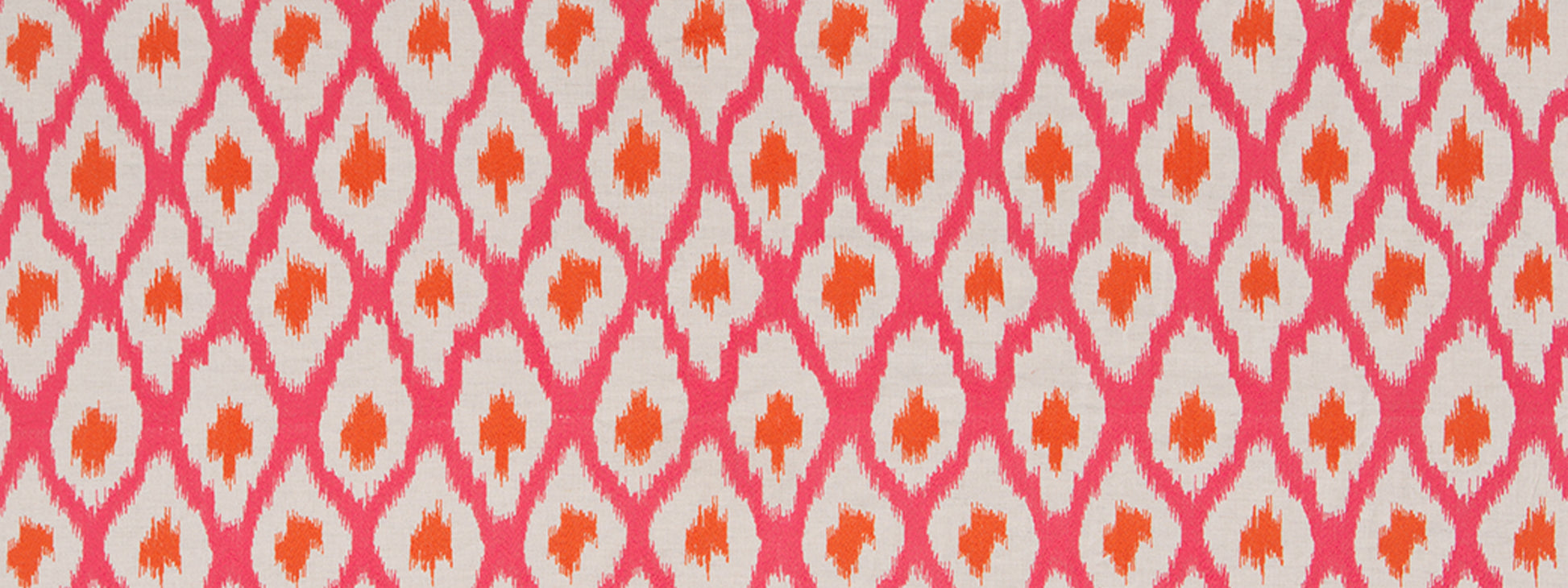 Close-up fabric pattern: pink diamond lattice with orange centers on a light background.