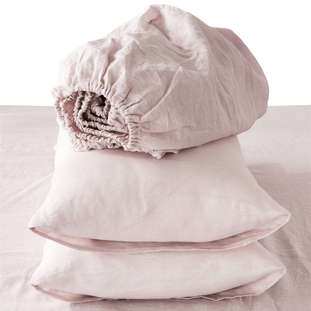 Soft light gray linen four-piece sheet set with matching pillowcases, California King size.