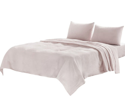 Light gray linen four-piece California King sheet set; includes fitted sheet, flat sheet, and two pillowcases on a bed.