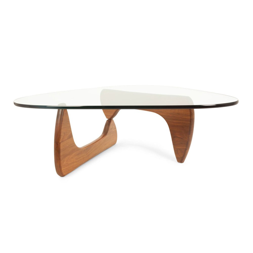 Triangle glass-top coffee table with clear and brown glass and warm solid wood curved legs forming a sculptural bridge base.