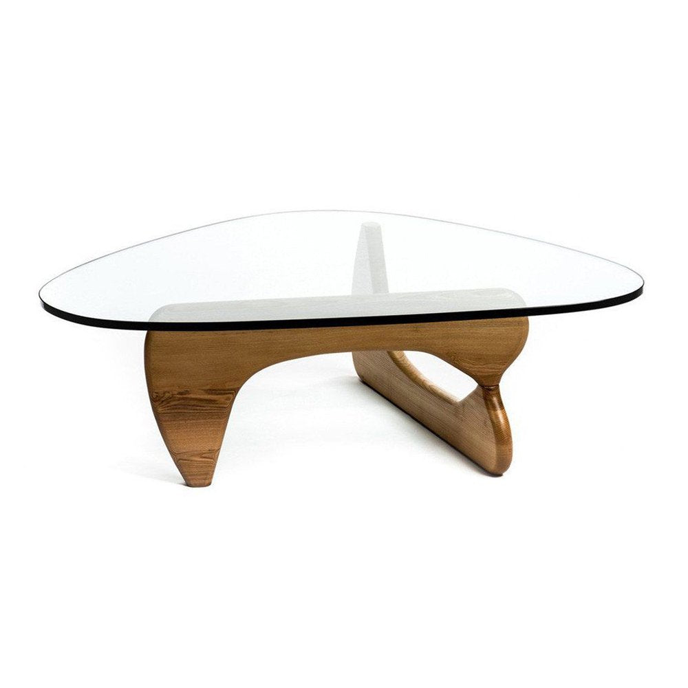 Clear round glass coffee table with a black edge and natural wood sculptural curved base.