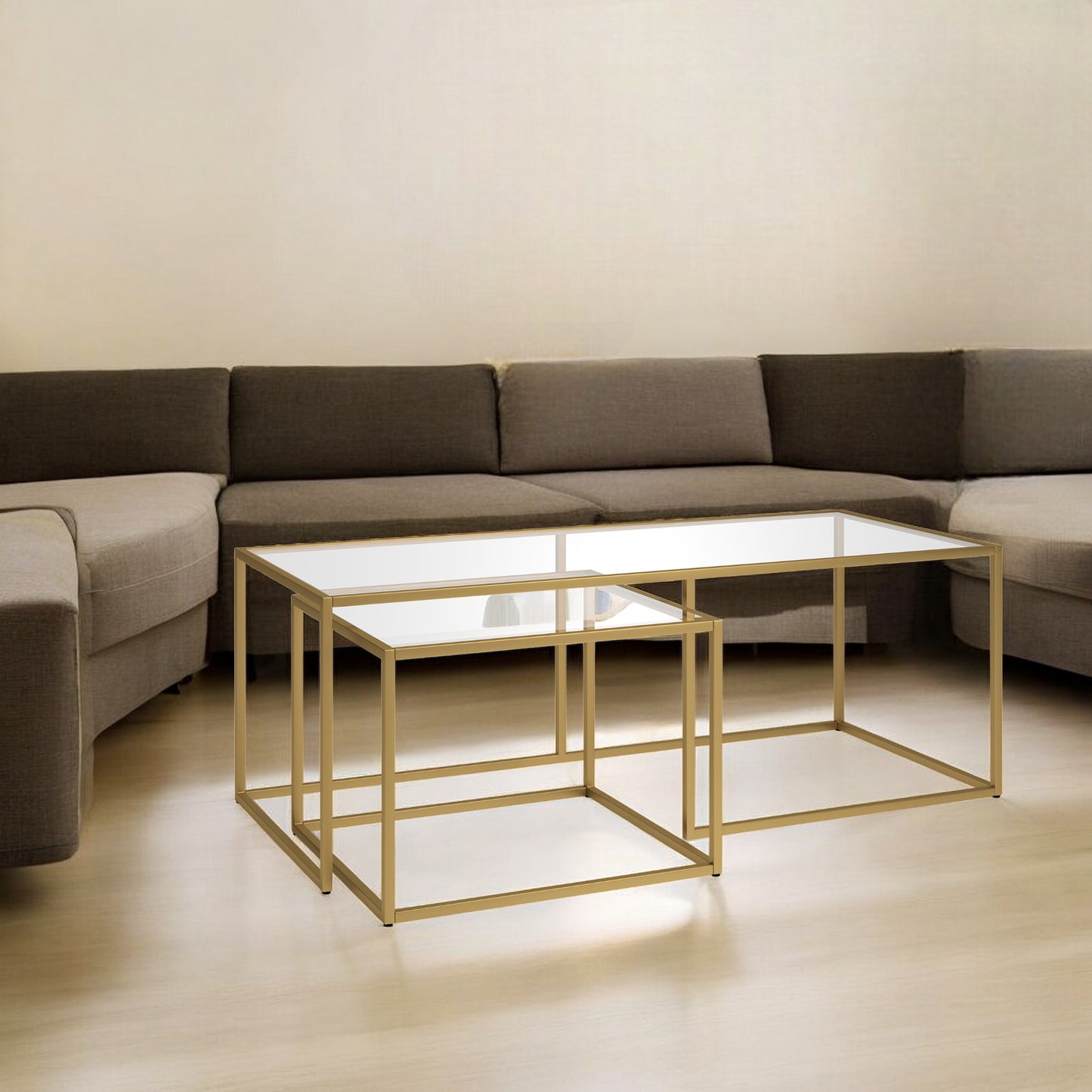 Set of Two 50" Gold Glass And Steel Nested Coffee Tables