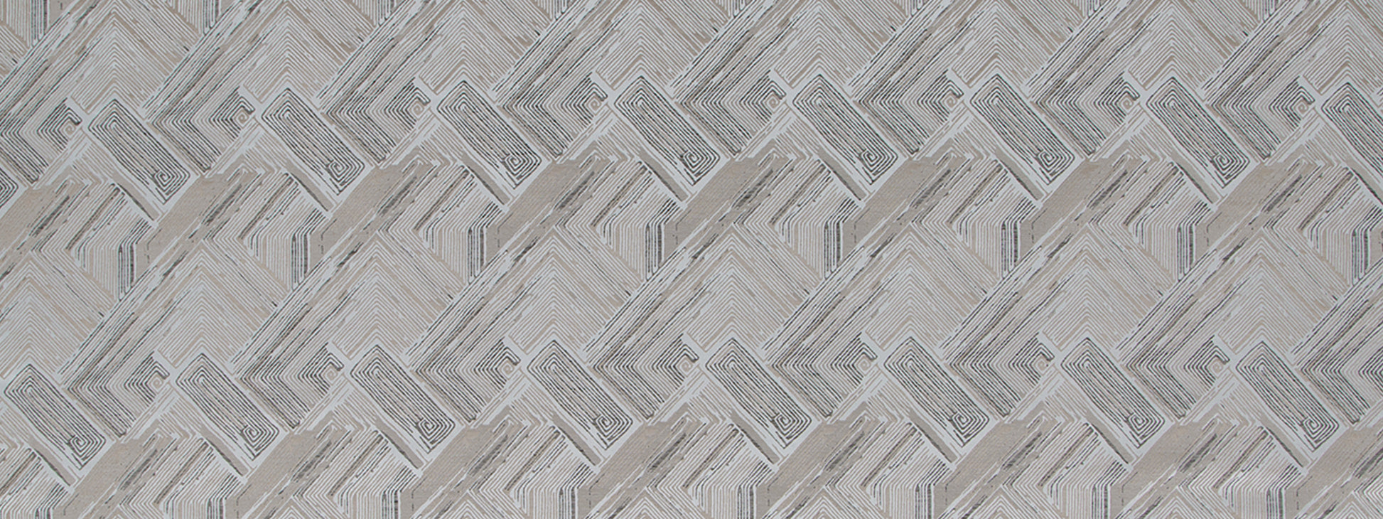 Grey upholstery fabric with a repeating interlocking chevron pattern in a zinc color.