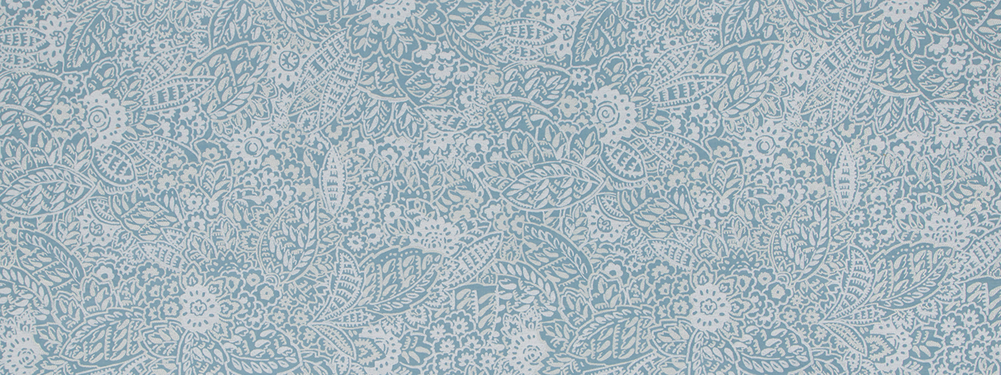 Light blue lace upholstery fabric with white floral motifs and scrolling vine pattern.