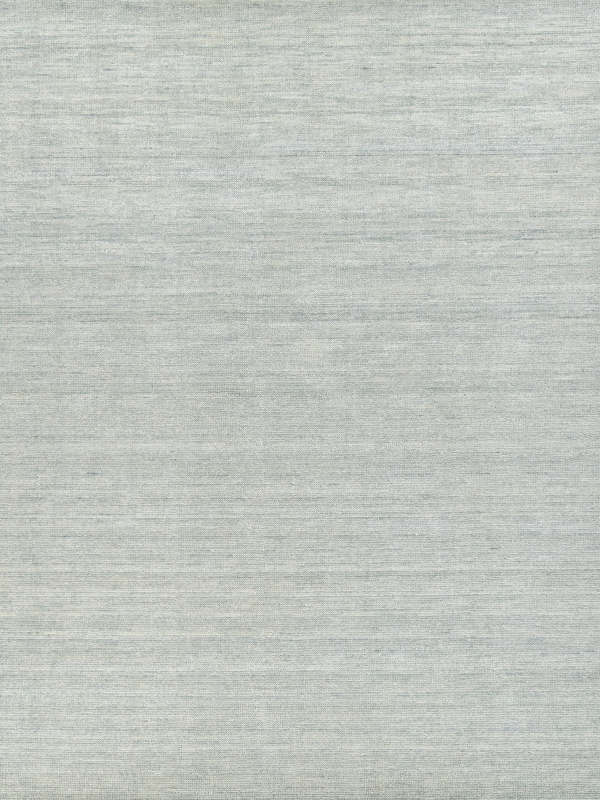 Light gray heather fabric texture with subtle woven lines.