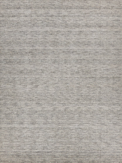 Gray heathered woven rug texture with neutral taupe-gray tones and subtle flat-weave look.