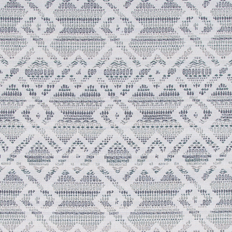 Gray and white geometric ikat-inspired woven fabric with diamond motifs.