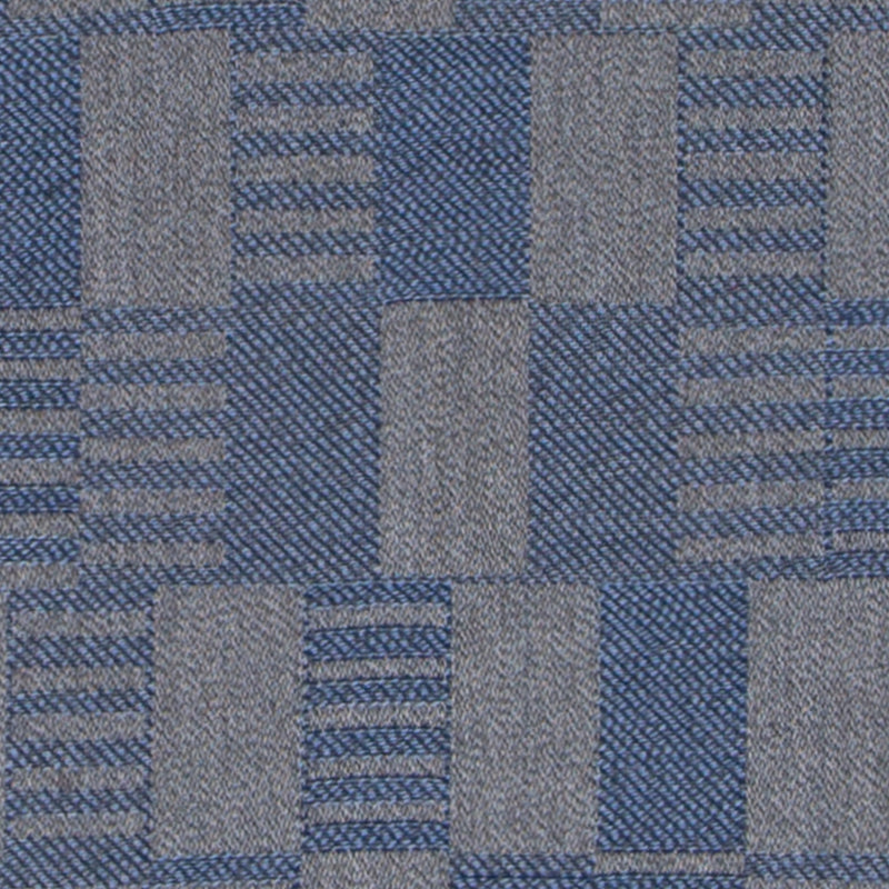 Graphite gray fabric swatch with a denim edge on the right; rectangular upholstery textile sample.