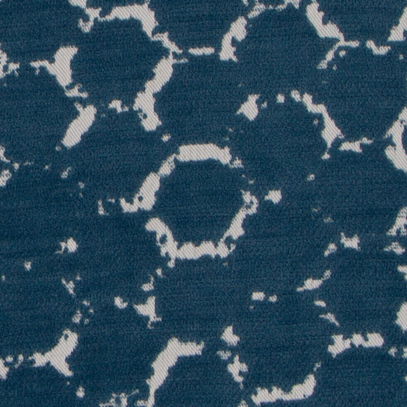 Navy blue woven textile with cream ring-like hexagon motifs; contemporary geometric pattern for upholstery.