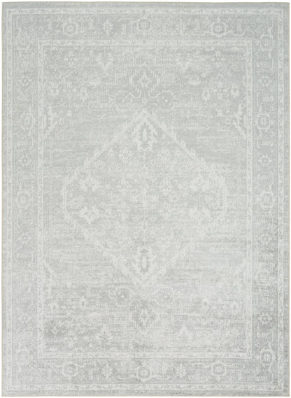 Light gray distressed oriental rug with central diamond medallion and decorative border.