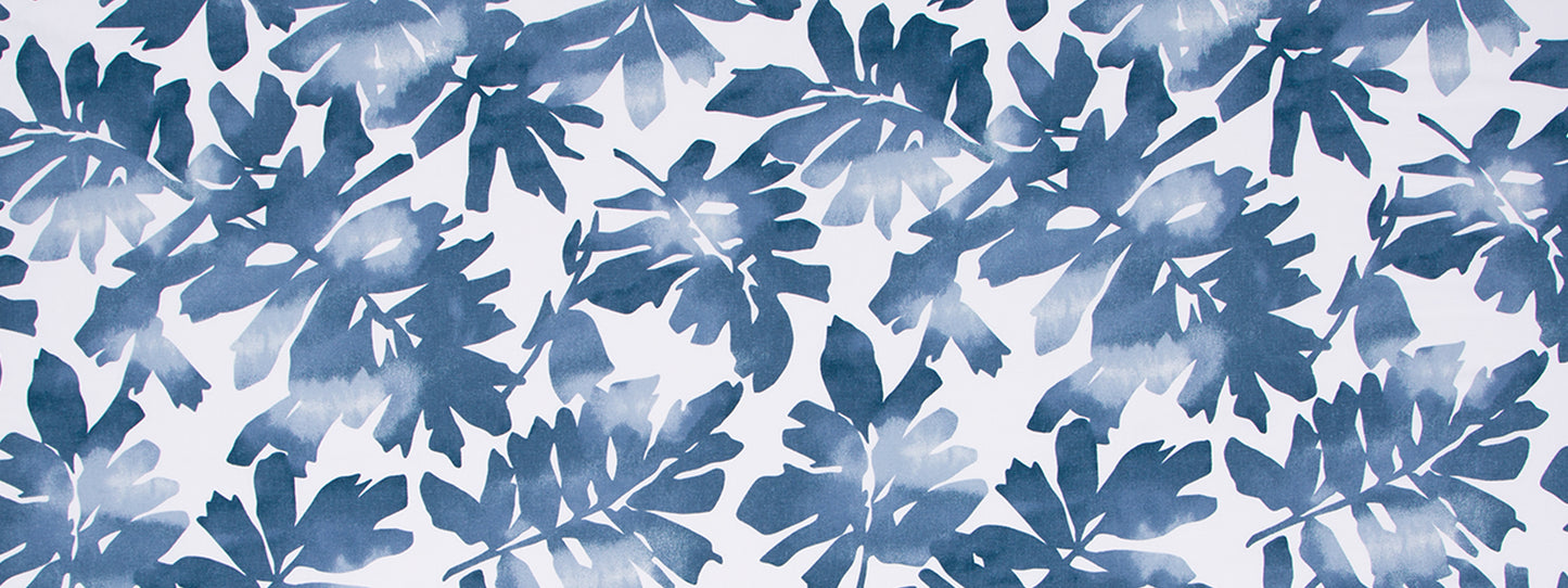 Midnight blue abstract cutout-inspired pattern with repeating shapes on fabric print.