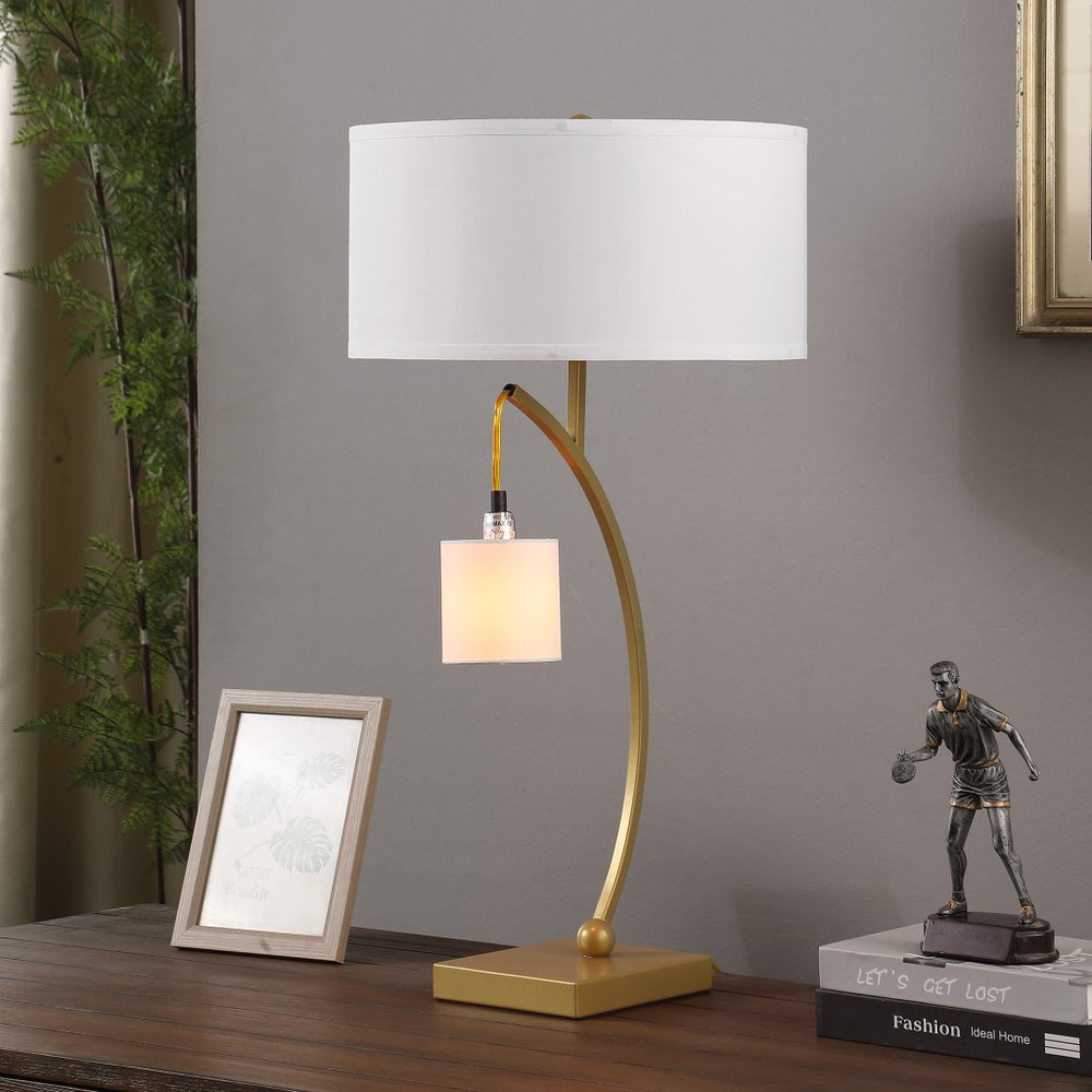 29" gold metal arched table lamp with white drum shade and two lights.