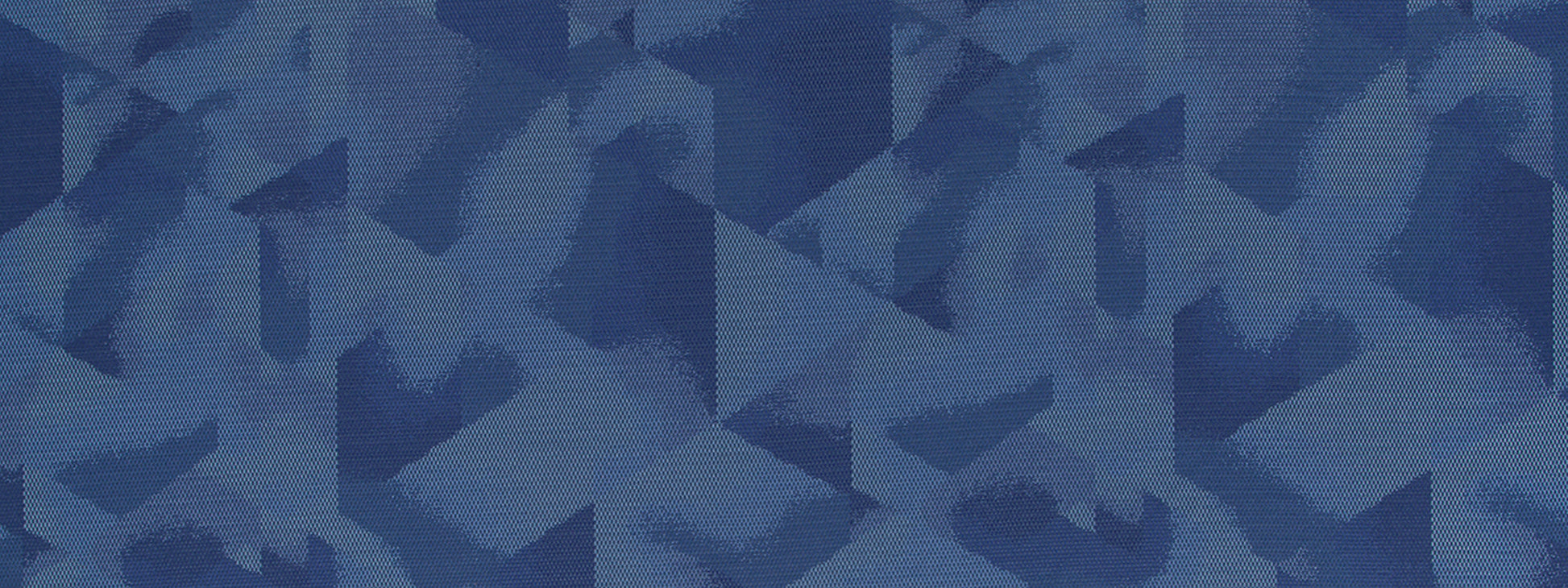 Blue denim camouflage fabric texture with irregular brush-stroke shapes.