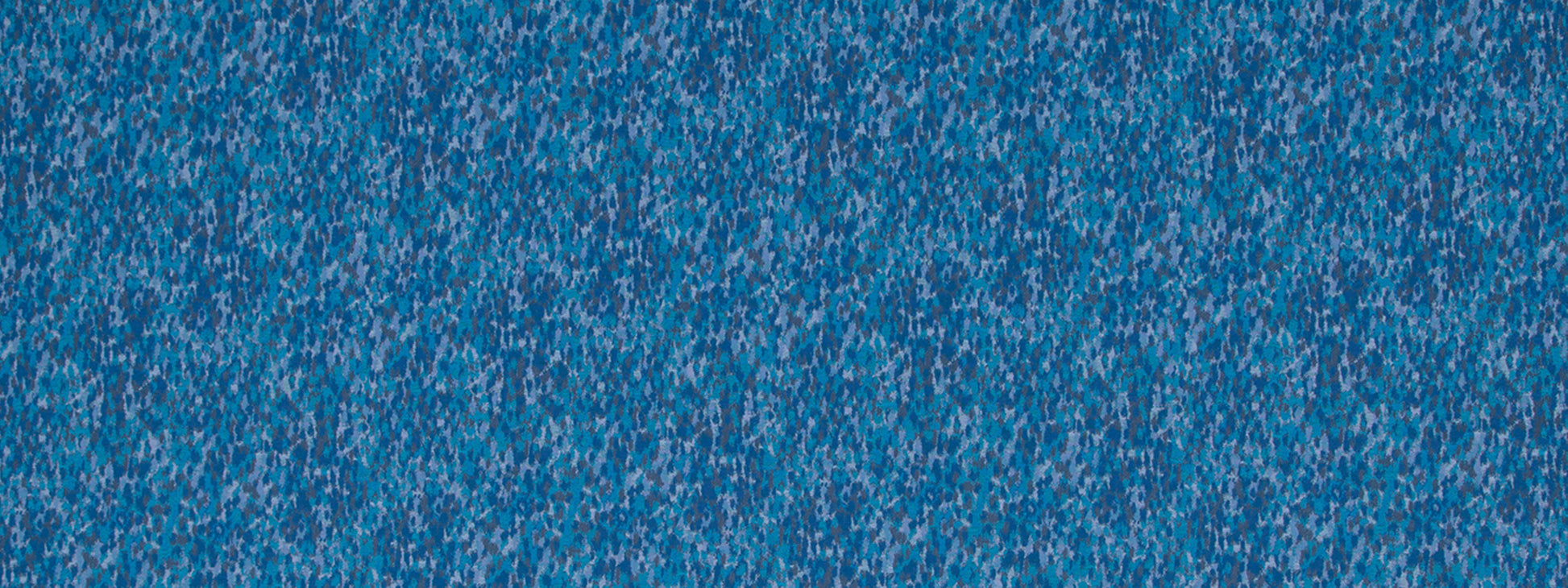 Close-up of blue speckled textured upholstery fabric with tiny white flecks.