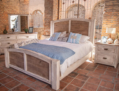 Cream solid wood four-drawer chest in a brick-walled bedroom.