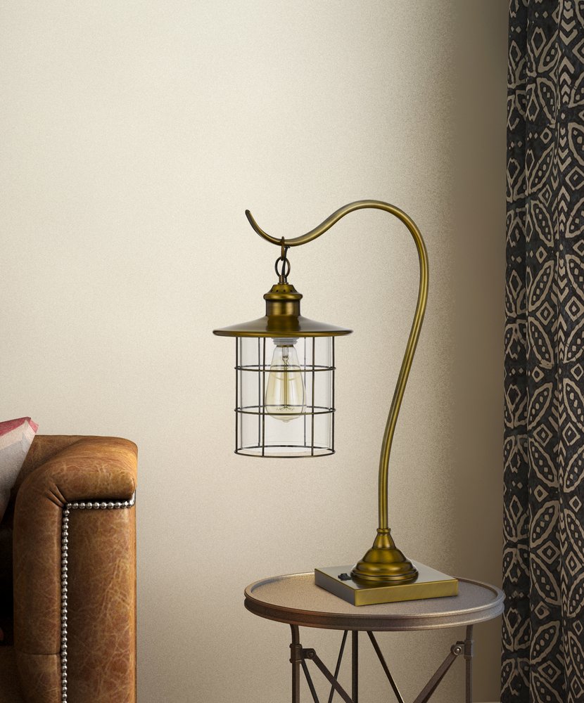 25" antiqued brass metal lantern desk lamp with an antiqued brass drum shade.