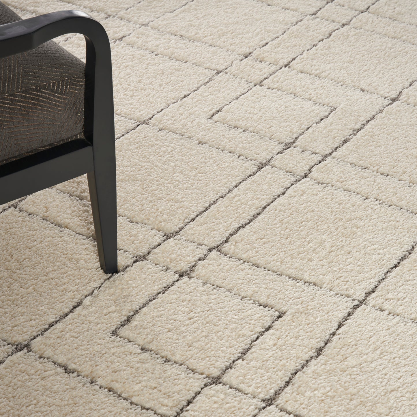 Nourison Dreamy Shag 9' x 12' ivory area rug from Primoends with ultra-plush shag pile, soft neutral color, modern indoor rug for living room or bedroom décor.