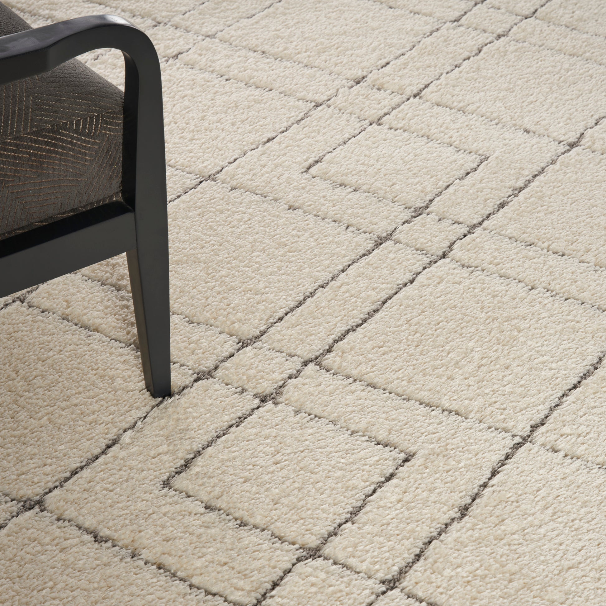 Nourison Dreamy Shag 9' x 12' ivory area rug from Primoends with ultra-plush shag pile, soft neutral color, modern indoor rug for living room or bedroom décor.