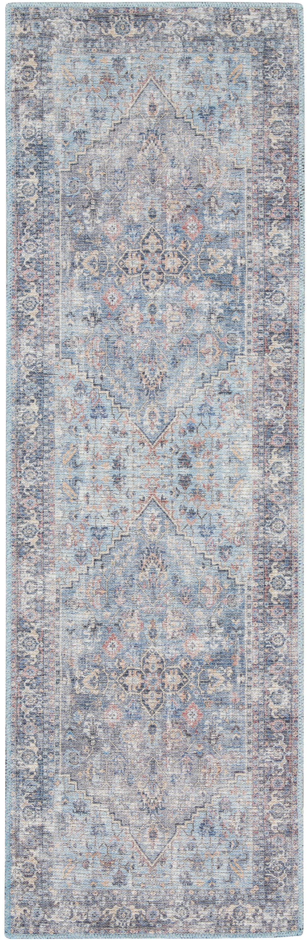 Distressed blue vintage runner rug with central medallion motifs, ivory and rust accents, ornate border.