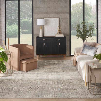Modern living room with black mid-century sideboard, beige sofa, tan lounge chair, gold accents, large window backdrop, neutral rug.