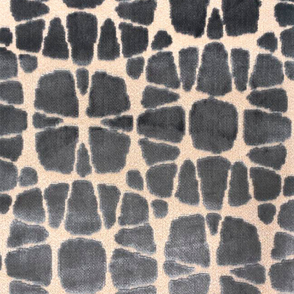 Grey stone-like pebble pattern on beige background; fabric texture suitable for upholstery or home decor.