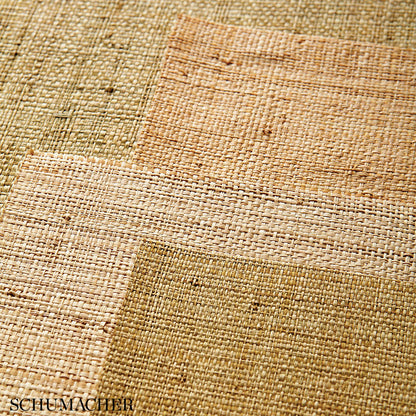 Patchwork jute rug in natural beige, tan and brown tones with a coarse woven texture and rustic earthy style.