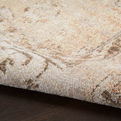 Beige cream plush area rug with subtle geometric motif over dark wood floor
